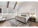 Cozy primary bedroom with large windows and a decorative chandelier at 7304 Wexford Woods Ln, Wake Forest, NC 27587