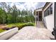 Beautiful stone patio, perfect for relaxing, leading to home at 7304 Wexford Woods Ln, Wake Forest, NC 27587