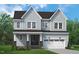 Charming two-story home with light blue siding, a covered porch, and an attached garage at 812 Ballaster Rd, Fuquay Varina, NC 27526
