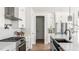 Well-lit kitchen with an island sink, stainless steel appliances, and white cabinets at 812 Ballaster Rd, Fuquay Varina, NC 27526