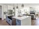Modern kitchen island with a large sink, white countertops, and wood floors at 812 Ballaster Rd, Fuquay Varina, NC 27526