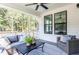 Relaxing screened-in sunroom with comfortable seating and view of backyard trees at 812 Ballaster Rd, Fuquay Varina, NC 27526