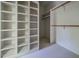 Organized walk-in closet features ample shelving and hanging space for efficient storage at 8200 Bromley Rd, Hillsborough, NC 27278