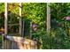 Charming garden gate with climbing plants and vibrant flowers, creating a serene entrance at 8200 Bromley Rd, Hillsborough, NC 27278