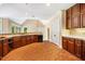 Spacious kitchen featuring tile floors, and wood cabinets against the light-colored walls at 8200 Bromley Rd, Hillsborough, NC 27278