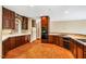 Bright kitchen featuring tile floors, wood cabinets, updated appliances, and lots of counter space at 8200 Bromley Rd, Hillsborough, NC 27278