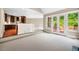 Inviting living room featuring carpeted floors, access to the kitchen, and access to the yard at 8200 Bromley Rd, Hillsborough, NC 27278