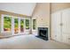 Inviting living room with carpeted floors, fireplace, built-ins, and outdoor access at 8200 Bromley Rd, Hillsborough, NC 27278