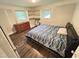 Cozy bedroom with hardwood floors, built-in shelving and bright natural light at 908 Valmet Dr, Durham, NC 27703