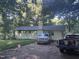 Lawn view of home featuring mature trees at 908 Valmet Dr, Durham, NC 27703