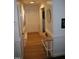 Entry hallway featuring hardwood floors, white trim, and access to the main living areas at 908 Valmet Dr, Durham, NC 27703
