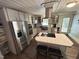 Bright kitchen featuring stainless steel appliances, a center island, and modern finishes at 908 Valmet Dr, Durham, NC 27703