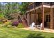 Multi-tiered yard featuring a hot tub under the covered patio and beautiful landscaping at 1009 Margarets Ln, Raleigh, NC 27614