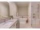 Bright bathroom featuring granite countertop, a freestanding tub and glass-enclosed shower at 1009 Margarets Ln, Raleigh, NC 27614