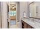 Bathroom with granite countertop, tile floor, and view to the bedroom at 1009 Margarets Ln, Raleigh, NC 27614