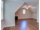 Spacious bedroom featuring hardwood floors, a large window, and ceiling fan at 1009 Margarets Ln, Raleigh, NC 27614