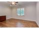 Bedroom with hardwood flooring and a chest of drawers near the window at 1009 Margarets Ln, Raleigh, NC 27614