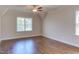 Spacious bedroom featuring hardwood floors, recessed lighting, and a window providing natural light at 1009 Margarets Ln, Raleigh, NC 27614
