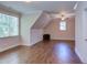 Spacious bedroom featuring hardwood floors, a large window, and ceiling fan at 1009 Margarets Ln, Raleigh, NC 27614
