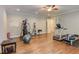 Large home gym featuring modern equipment, a ceiling fan, and hardwood floors at 1009 Margarets Ln, Raleigh, NC 27614