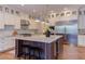 Bright, open kitchen with a large island, stainless steel appliances, and custom cabinets at 1009 Margarets Ln, Raleigh, NC 27614