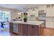 Spacious kitchen featuring a marble island with seating and modern appliances at 1009 Margarets Ln, Raleigh, NC 27614