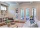Bright living room features built-in shelves and french doors to an outdoor space at 1009 Margarets Ln, Raleigh, NC 27614