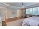 Main Bedroom featuring natural light, hardwood floors, tray ceiling, and neutral color palette at 1009 Margarets Ln, Raleigh, NC 27614