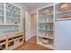 Well-organized pantry with wooden cabinets, granite counters, open shelving and beverage storage at 1009 Margarets Ln, Raleigh, NC 27614
