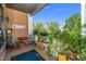 Charming balcony furnished with seating and adorned with lush plants, offering a relaxing outdoor space at 105 Chatham Walk Ln # 304, Cary, NC 27511