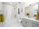 Bright bathroom with a shower-tub combo, modern vanity, and a well-lit mirror, creating a functional space at 105 Chatham Walk Ln # 304, Cary, NC 27511