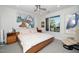 Bright bedroom with a large window, ceiling fan, and unique artwork creating a peaceful atmosphere at 105 Chatham Walk Ln # 304, Cary, NC 27511