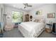 Relaxing bedroom with a queen bed, large window, and unique touches, offering a comfortable retreat at 105 Chatham Walk Ln # 304, Cary, NC 27511