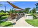 Community space with outdoor kitchen, seating, and covered dining area for residents to enjoy at 105 Chatham Walk Ln # 304, Cary, NC 27511