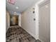 Hallway with carpet and light fixtures, leading to residential units at 105 Chatham Walk Ln # 304, Cary, NC 27511