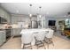 Well-designed kitchen with island seating, stainless steel appliances, and open floor plan at 105 Chatham Walk Ln # 304, Cary, NC 27511