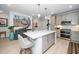Well-appointed kitchen with stainless steel appliances, gray cabinetry, and a center island providing ample counter space at 105 Chatham Walk Ln # 304, Cary, NC 27511
