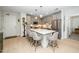 Modern kitchen featuring stainless steel appliances, gray cabinetry, and a spacious center island with pendant lighting at 105 Chatham Walk Ln # 304, Cary, NC 27511