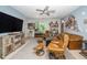 Well-decorated living room with hardwood floors, a plush rug, and comfortable seating, creating a warm and inviting space at 105 Chatham Walk Ln # 304, Cary, NC 27511