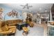Open-concept living room seamlessly connected to a modern kitchen, creating a spacious and inviting atmosphere at 105 Chatham Walk Ln # 304, Cary, NC 27511