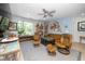 Bright living room featuring hardwood floors, large windows, comfortable seating, and stylish decor at 105 Chatham Walk Ln # 304, Cary, NC 27511