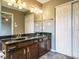 Bathroom with double vanity and a full mirror at 108 S Drawbridge Ln, Cary, NC 27513