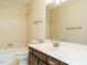 Bathroom featuring vanity with white countertop and sink, bathtub with shower and neutral walls at 108 S Drawbridge Ln, Cary, NC 27513
