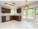 Bright kitchen with stainless steel dishwasher, spacious countertops, and ample natural light at 108 S Drawbridge Ln, Cary, NC 27513