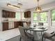 Bright kitchen with stainless appliances and bay window at 108 S Drawbridge Ln, Cary, NC 27513