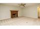 Living room with fireplace and ceiling fan, neutral walls, and wall to wall carpet at 108 S Drawbridge Ln, Cary, NC 27513