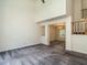 Open-concept living area with plush carpeting and view of the dining room and staircase at 108 S Drawbridge Ln, Cary, NC 27513