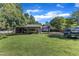 A large backyard with covered parking, boat, truck, and ample green space at 109 Mill Creek Dr, Youngsville, NC 27596