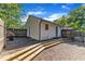 A home's backyard featuring a wood deck, brick patio, and siding at 109 Mill Creek Dr, Youngsville, NC 27596