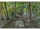 View of backyard path and trees at 109 Mill Creek Dr, Youngsville, NC 27596